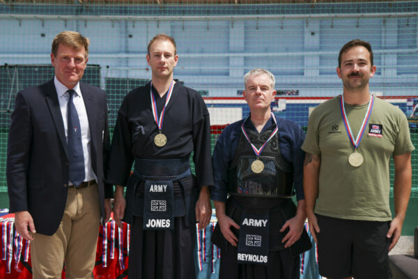 Pictured: Army Kendo Team presented with a gold medal from First Sea Lord, Admiral Ben Key, for team sparing during the Martial Arts Inter Services Championship 2022 held at HMS Nelson, Portsmouth. 

MARTIAL ARTS INTER SERVICES CHAMPIONSHIP 2022

On 16th-17th July 2022, the Royal Navy Royal Marines Mixed Martial Arts Association hosted the Martial Arts Inter Services Championship 2022 at HMS Nelson, Portsmouth. It is the first Martial Arts Inter Services Championship since 2019, as COVID-19 discontinued 2020 and 2021 championships. 

Service members from a variety of martial arts disciplines, including Brazilian Jiu-Jitsu (BJJ), World Taekwondo Federation (WT), International Taekwondo Federation (ITF), and Kendo, competed in the Martial Arts Inter Services Championship 2022. The Army Karate team was unable to compete, so a different championship will be held for the Karate team later this year.

International Taekwondo Federation and Kendo competition was held on Saturday, 16th July 2022; World Taekwondo Federation and Brazilian Jiu-Jitsu competition was held on 17th July 2022.  

Kendo is a modern Japanese martial art, descended from kenjutsu, one of traditional Japanese martial arts, swordsmanship, that is bamboo swords as well as protective armour. Kendo competition consist of 3 Royal Navy and 3 Army competitors. AB Nolan, AB Howell and Major Bowlem won gold for team sparring and AB Nolan won gold for kata.