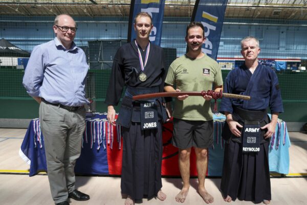 Pictured: Major Jones, Major Raynolds and Major Frost from the British Army win the Kendo competition during the  Martial Arts Inter Services Championship 2022 held at HMS Nelson, Portsmouth. 

MARTIAL ARTS INTER SERVICES CHAMPIONSHIP 2022

On 16th-17th July 2022, the Royal Navy Royal Marines Mixed Martial Arts Association hosted the Martial Arts Inter Services Championship 2022 at HMS Nelson, Portsmouth. It is the first Martial Arts Inter Services Championship since 2019, as COVID-19 discontinued 2020 and 2021 championships. 

Service members from a variety of martial arts disciplines, including Brazilian Jiu-Jitsu (BJJ), World Taekwondo Federation (WT), International Taekwondo Federation (ITF), and Kendo, competed in the Martial Arts Inter Services Championship 2022. The Army Karate team was unable to compete, so a different championship will be held for the Karate team later this year.

International Taekwondo Federation and Kendo competition was held on Saturday, 16th July 2022; World Taekwondo Federation and Brazilian Jiu-Jitsu competition was held on 17th July 2022.  

Kendo is a modern Japanese martial art, descended from kenjutsu, one of traditional Japanese martial arts, swordsmanship, that is bamboo swords as well as protective armour. Kendo competition consist of 3 Royal Navy and 3 Army competitors. AB Nolan, AB Howell and Major Bowlem won gold for team sparring and AB Nolan won gold for kata.